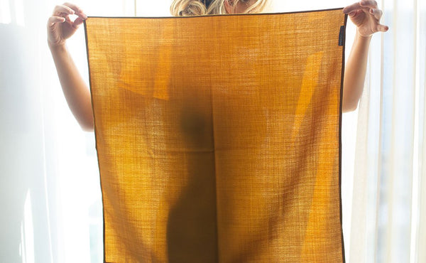A person holding the Shepherd's Wool Utility Cloth.